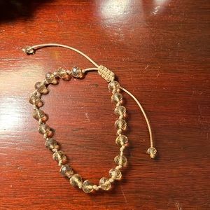 Homemade gold string bracelets